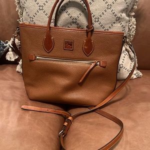 Dooney& Bourke brown Cognac color  zip closes inner pockets one zips